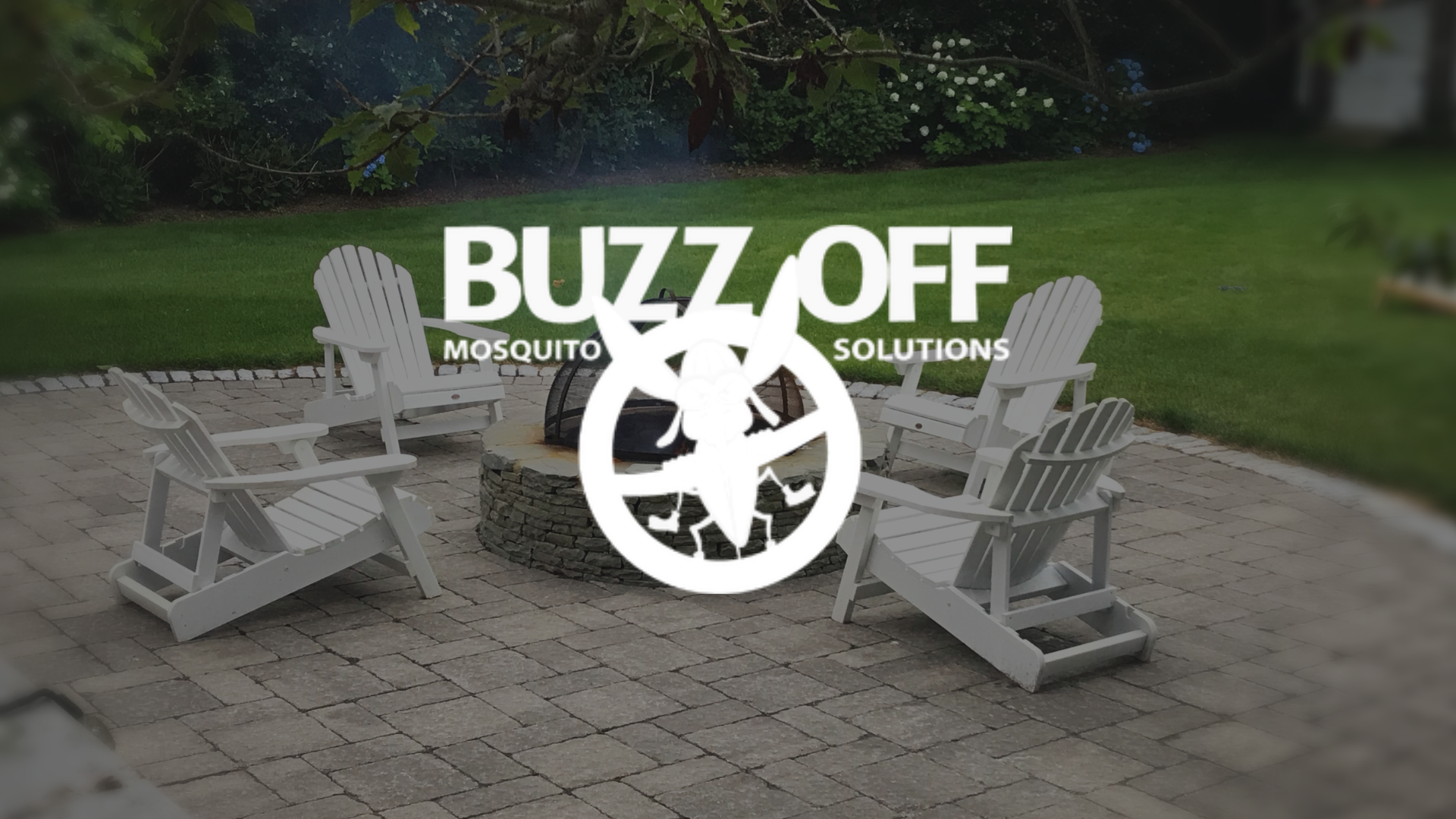 The logo for buzz off mosquito solutions is on a patio with a table and chairs.