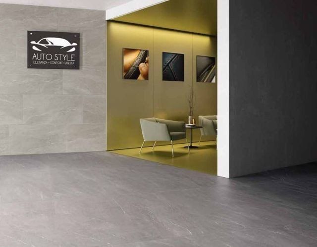 attività commerciale con rivestimenti grigi in ceramica