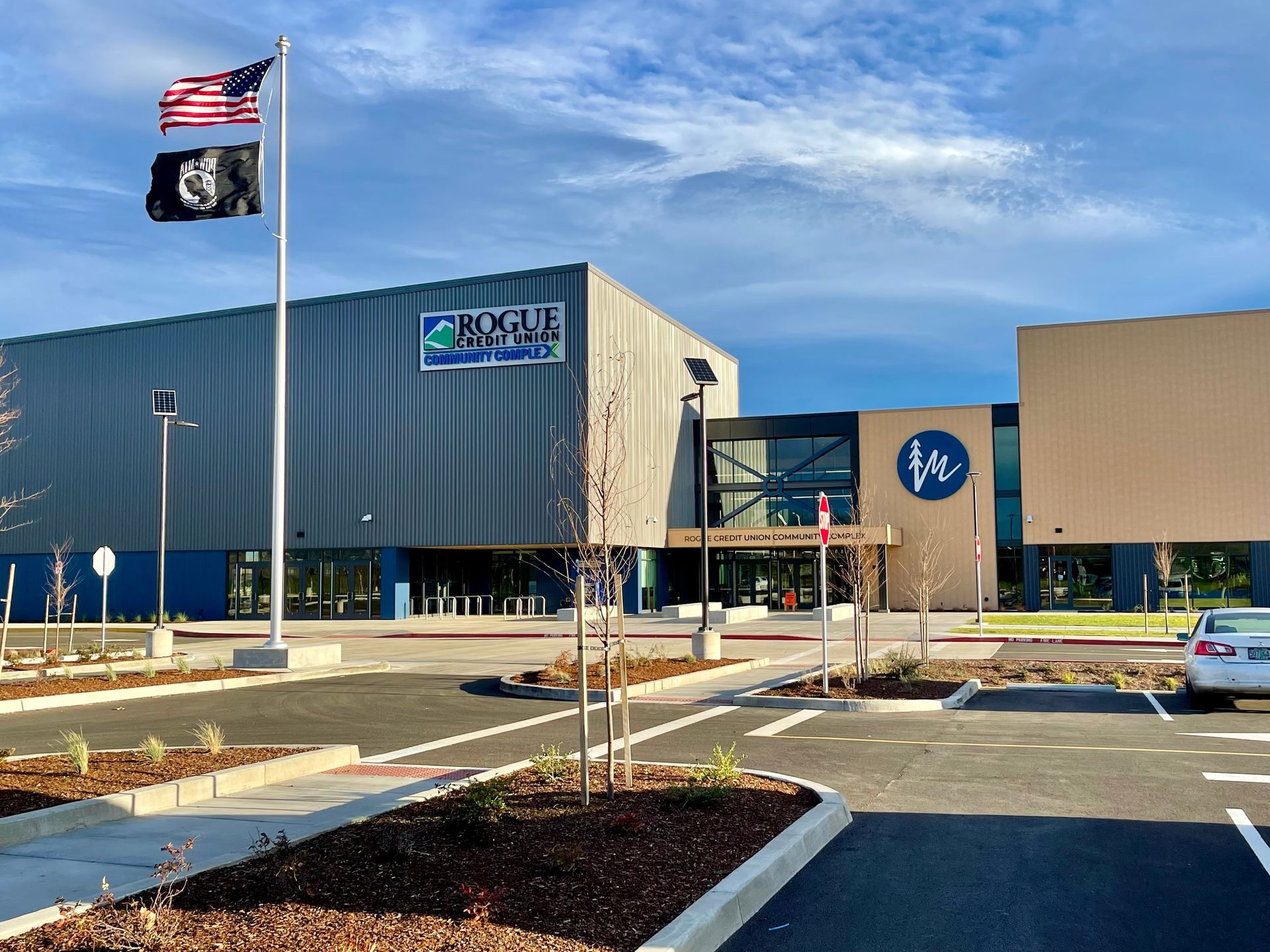 a swim meet with 2 swimmers ready to dive and a crowd watching