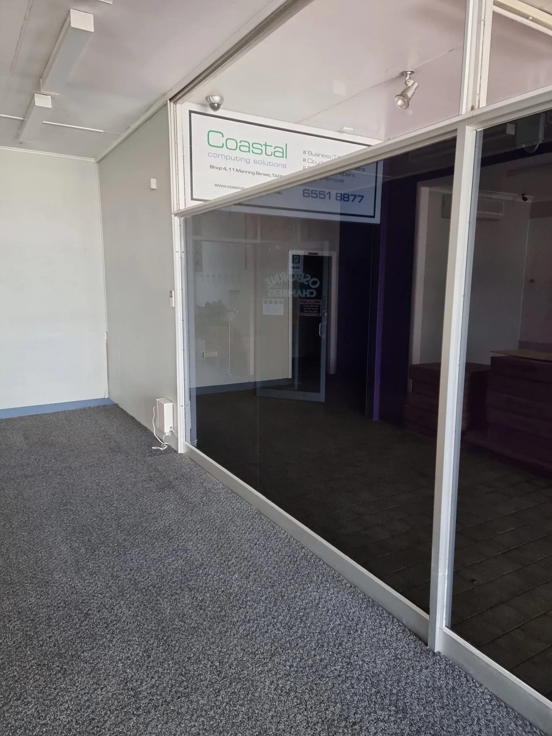 Empty Office Space With Coastal Software Sign — Awesome Window Tint In Wauchope, NSW