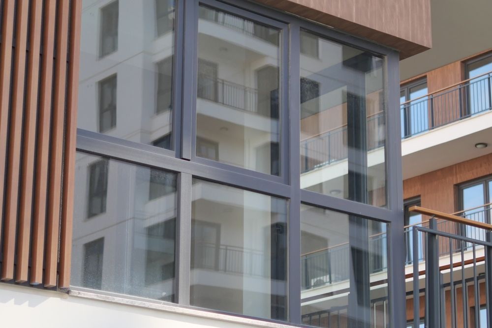 Large Windows Reflecting a Building — Awesome Window Tint In Tuncurry, NSW