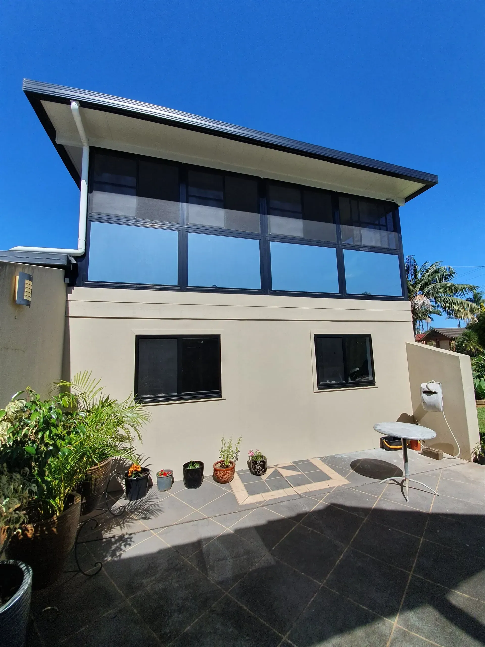Two-story Building With Tinted Windows — Awesome Window Tint In Wauchope, NSW