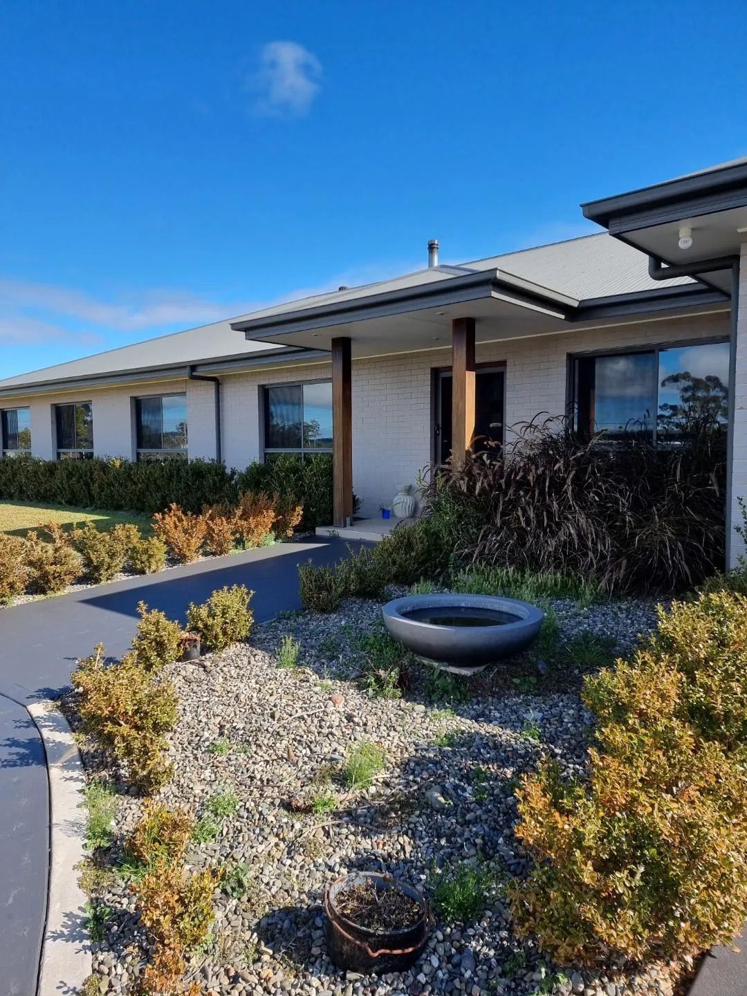 Single-story Brick House With a Dark Grey Roof — Awesome Window Tint In Wauchope, NSW