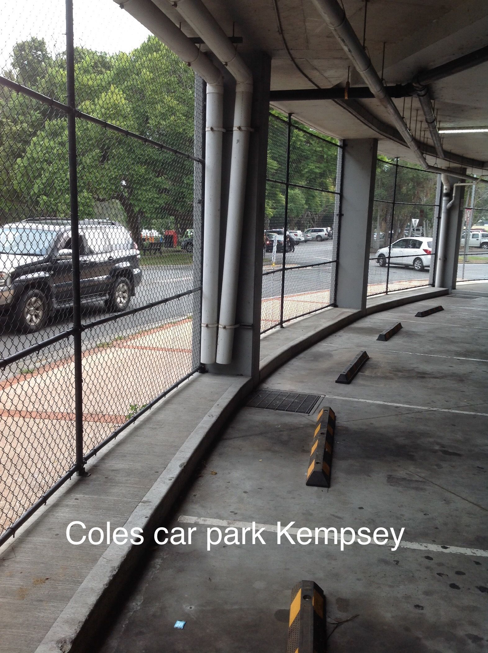 Chain-link Fence Against a Clear Blue Sky — Fencer Steve In Temagog, NSW
