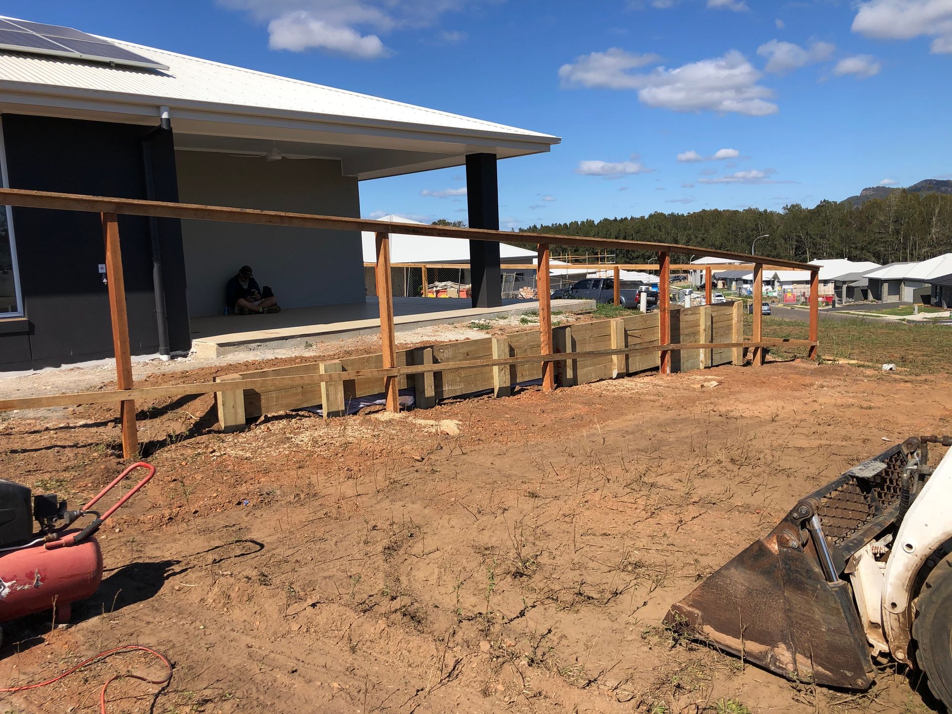 Wooden Fence Under Construction Next to a House on a Dirt Lot — Fencer Steve In Temagog, NSW
