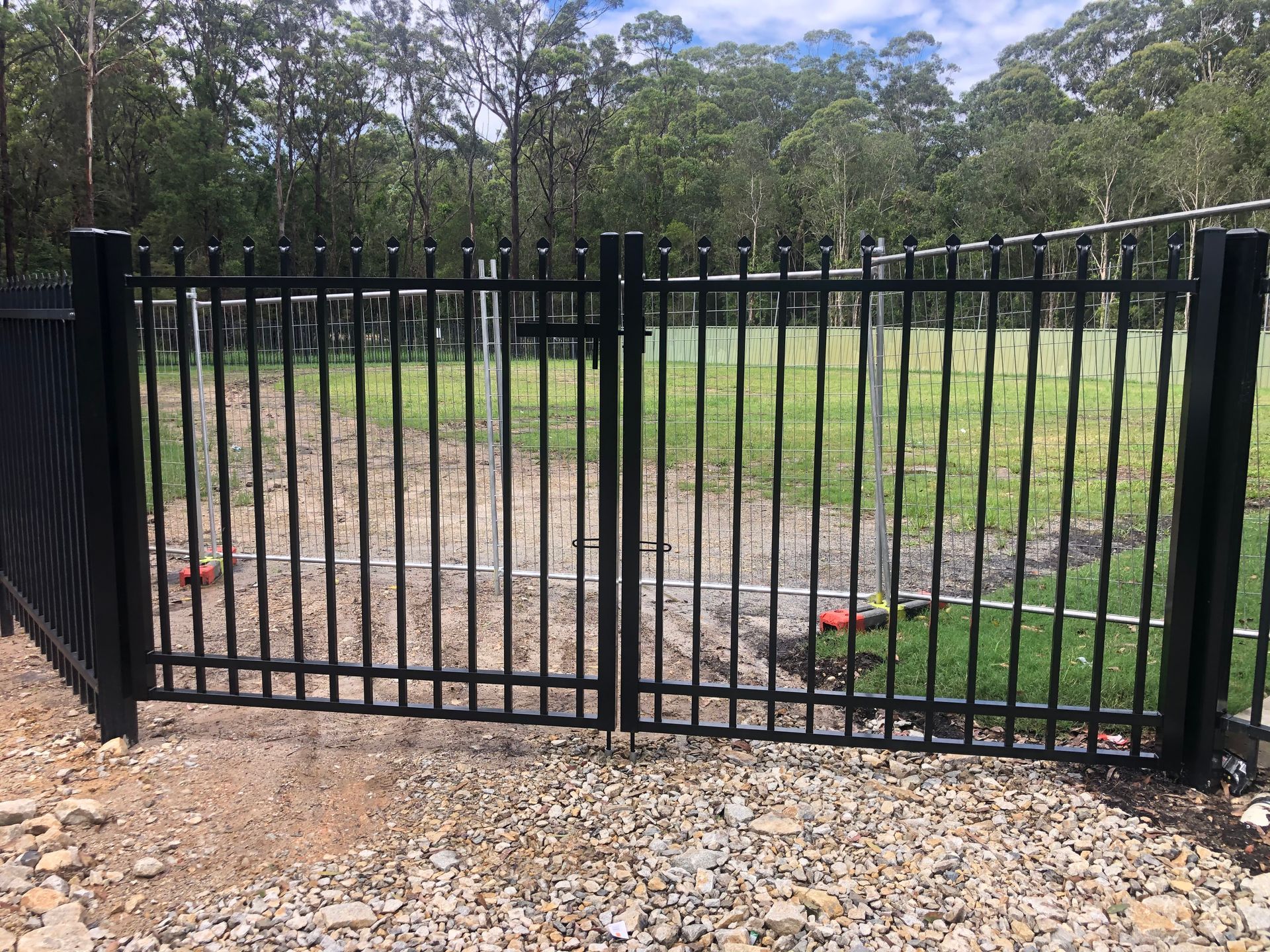 Wooden Fence Bordering Green Grass, Between Two Houses — Fencer Steve In Temagog, NSW