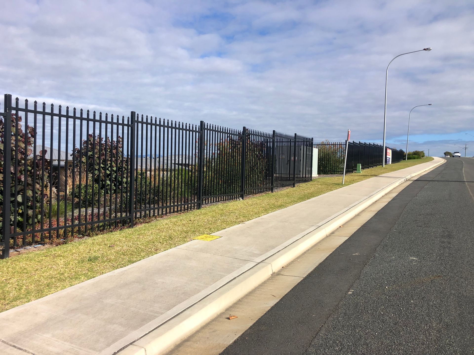 Wooden Fence in a Grassy Backyard, Sunlight on the Wood. Trees in the Background — Fencer Steve In Temagog, NSW
