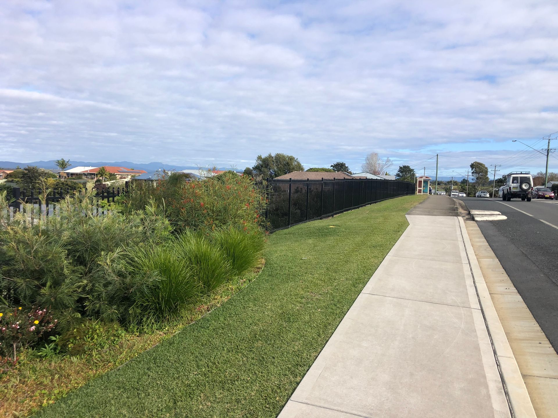 Sidewalk Next to a Road With a Grassy Verge — Fencer Steve In Temagog, NSW
