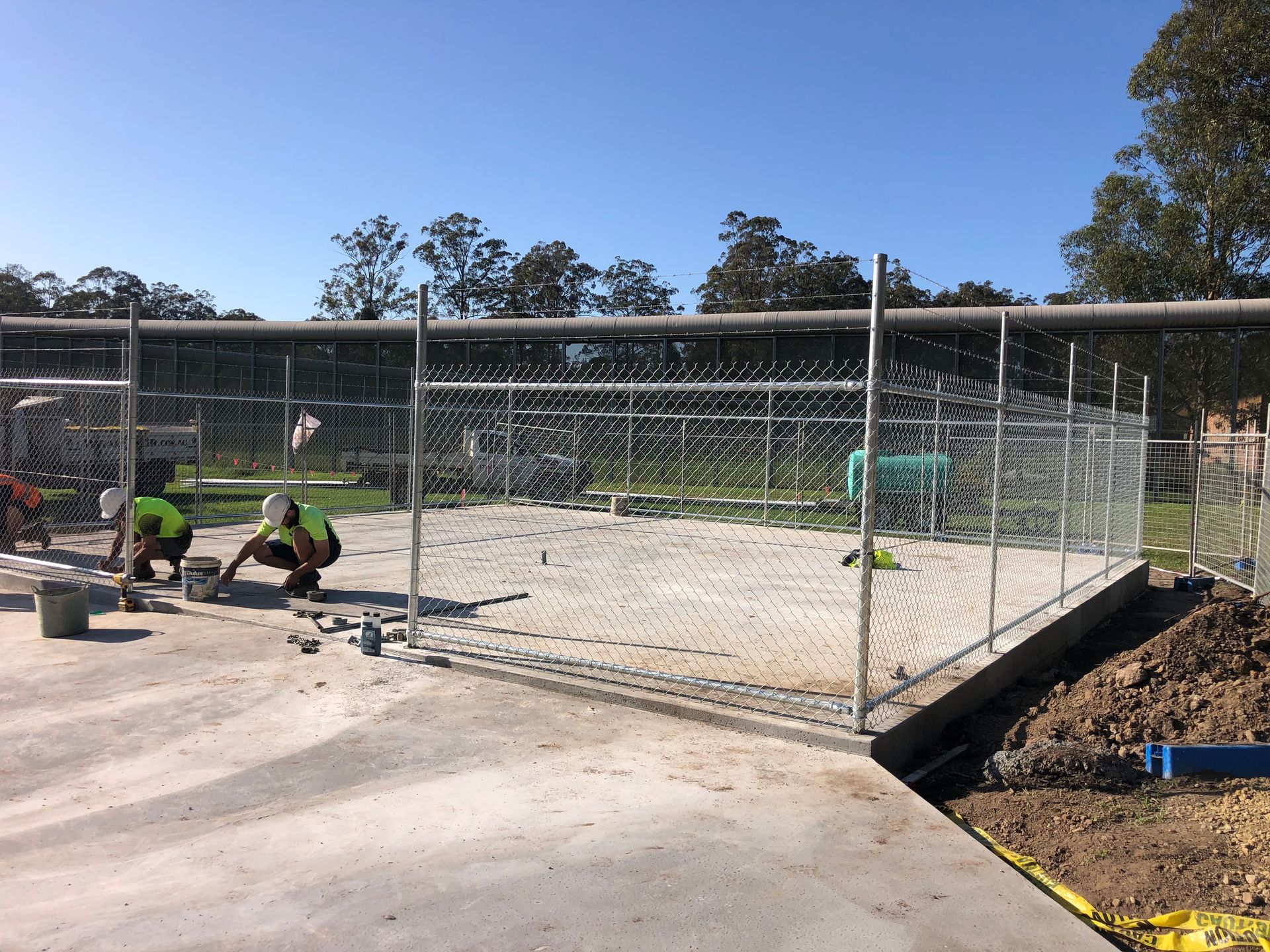 Wooden Privacy Fence With Vertical Slats and Metal Posts Along a Sidewalk — Fencer Steve In Temagog, NSW