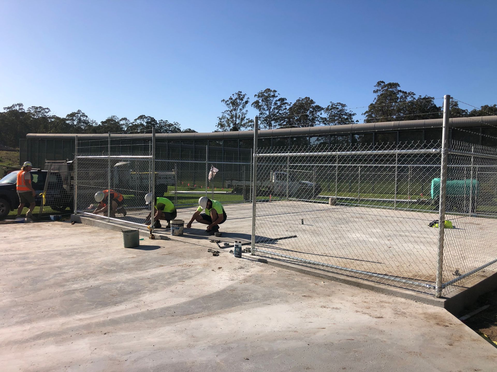 Construction Workers Installing a Chain-link Fence — Fencer Steve In Laurieton, NSW