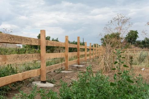 Wooden Split-rail Fence in a Grassy Field Under a Cloudy Sky — Fencer Steve In South West Rocks, NSW