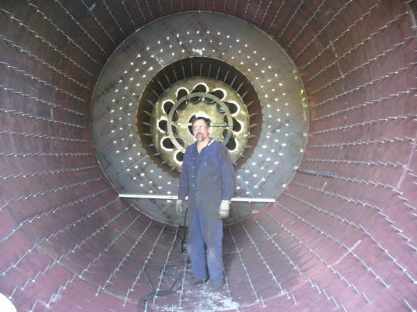 worker standing in combustion chamber