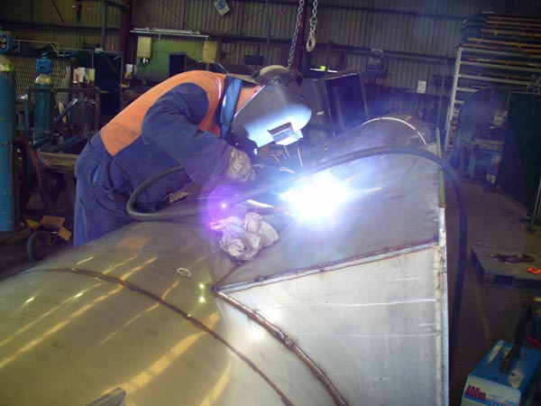 worker welding metal