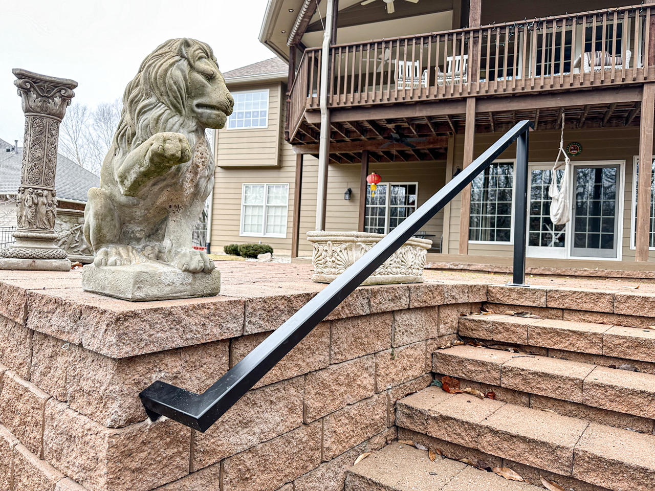 A Steel Railing on Porch Stairs, Installed in Mid-Missouri By Merit Welding.