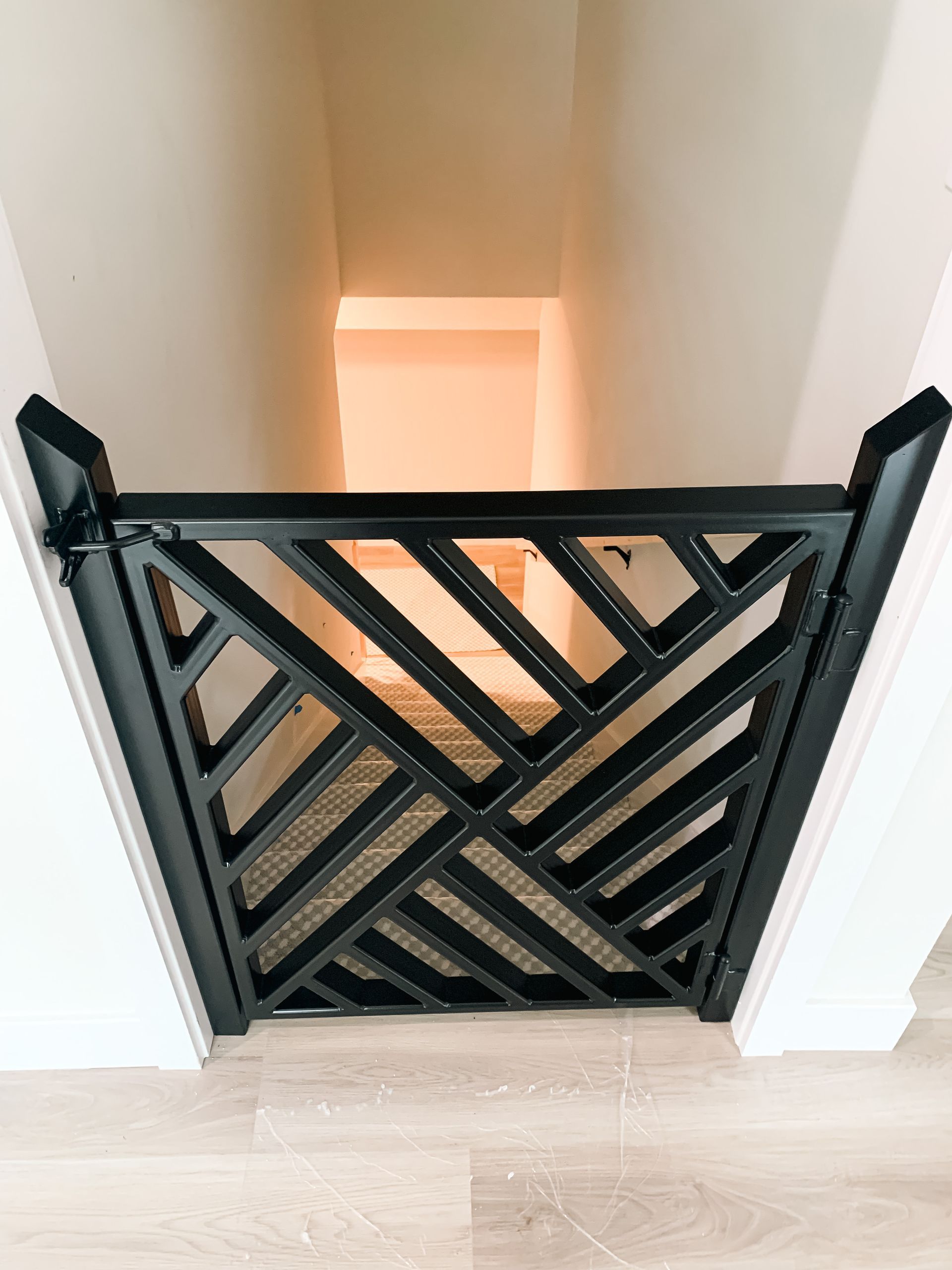 A Black, Steel Gate Leading Downstairs in a Mid-MO Home. Call Merit Welding Today!