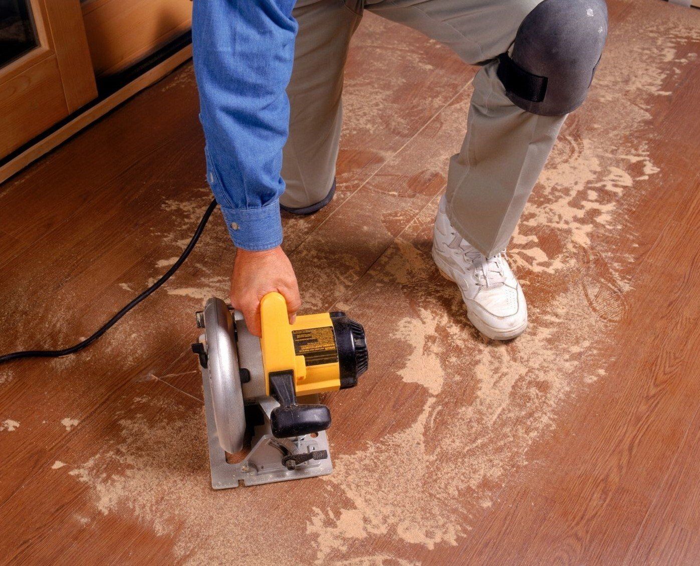 Langley Handyman grinding old floor surface