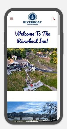 A cell phone displaying a website for the riverboat inn.