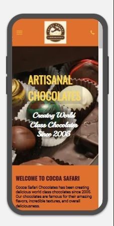 A cell phone displaying a website for artisanal chocolates