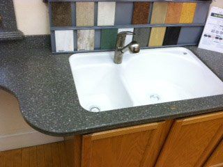 Kitchen Remodeling — White Sink on Dark Countertop in Syracuse, NY
