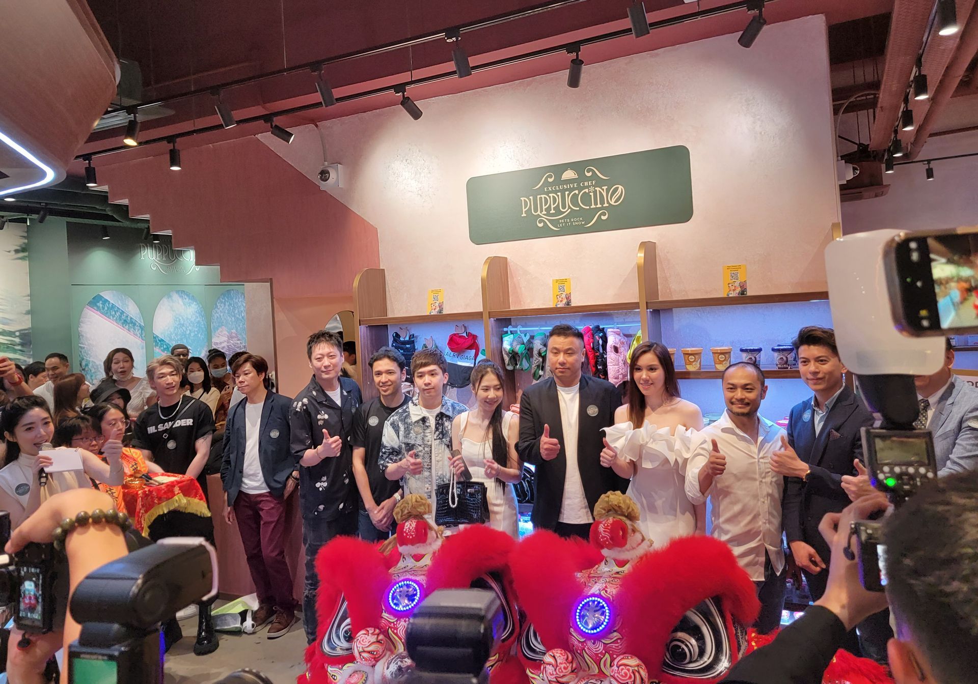 A group of people are posing for a picture in a room.