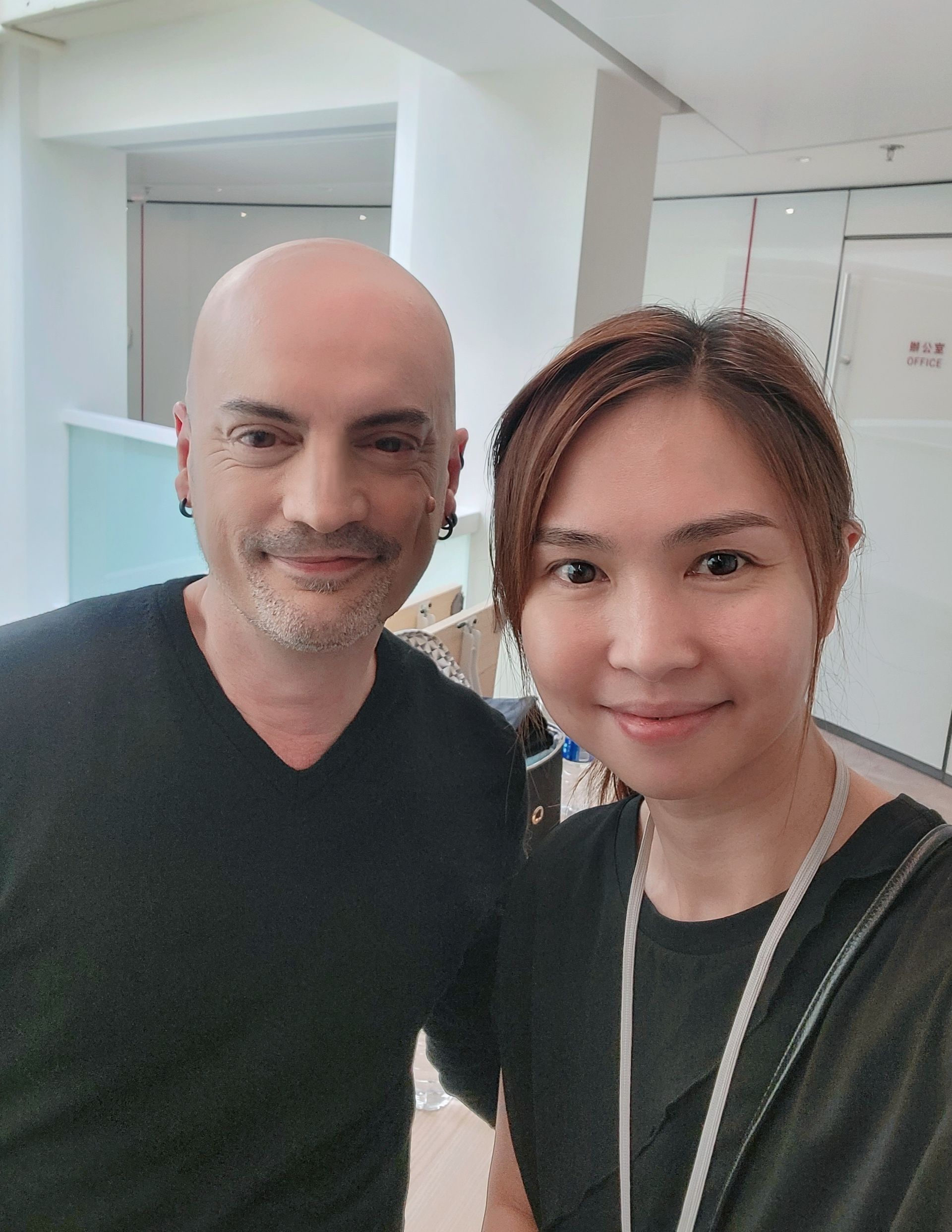 A man and a woman are posing for a picture together.