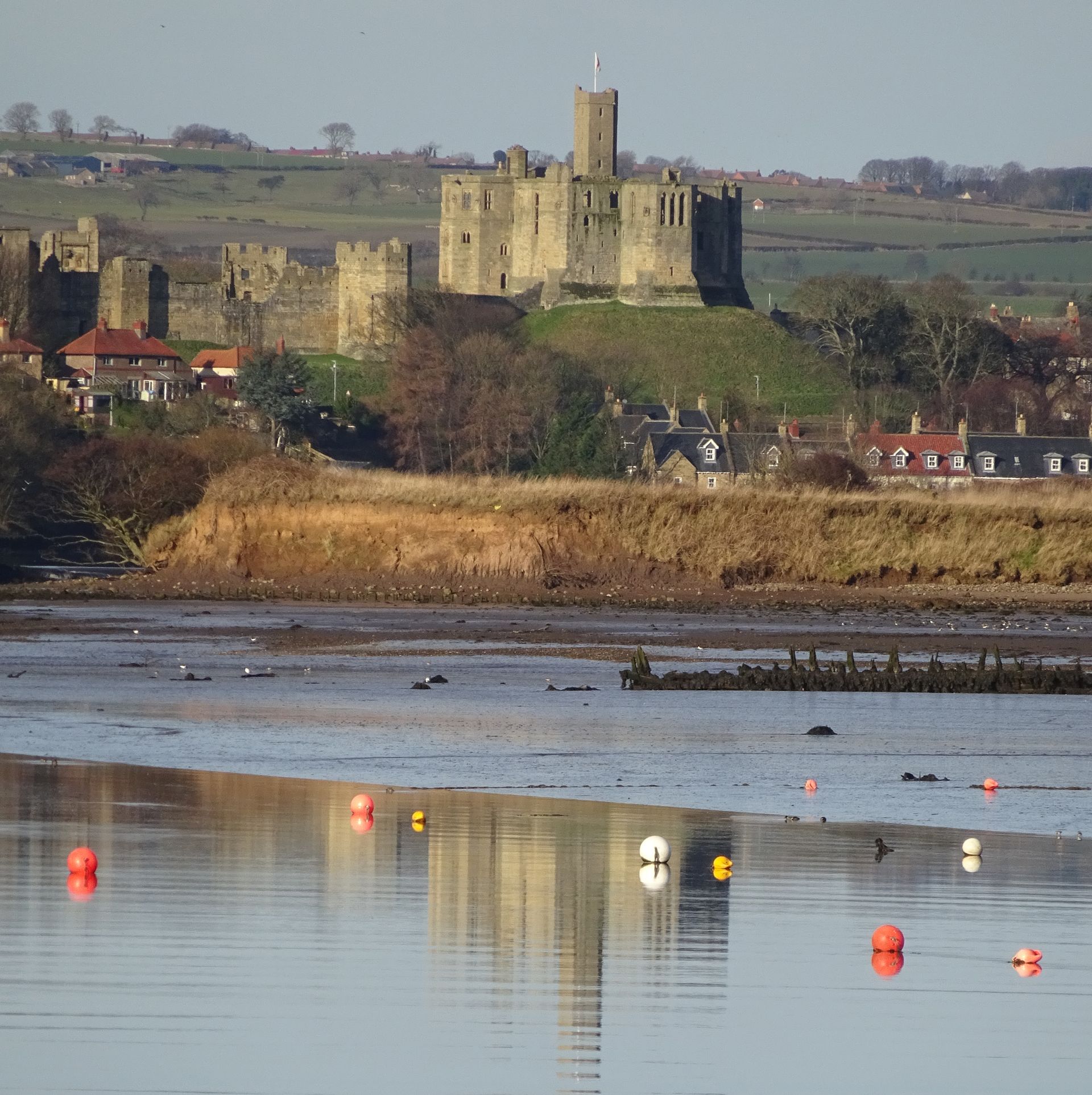 Warkworth Castle viewed from the Coquet Estuary.