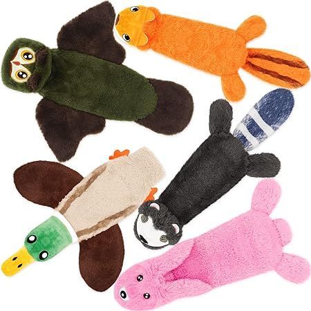 A group of stuffed animals including an owl a duck a squirrel and a pink pig