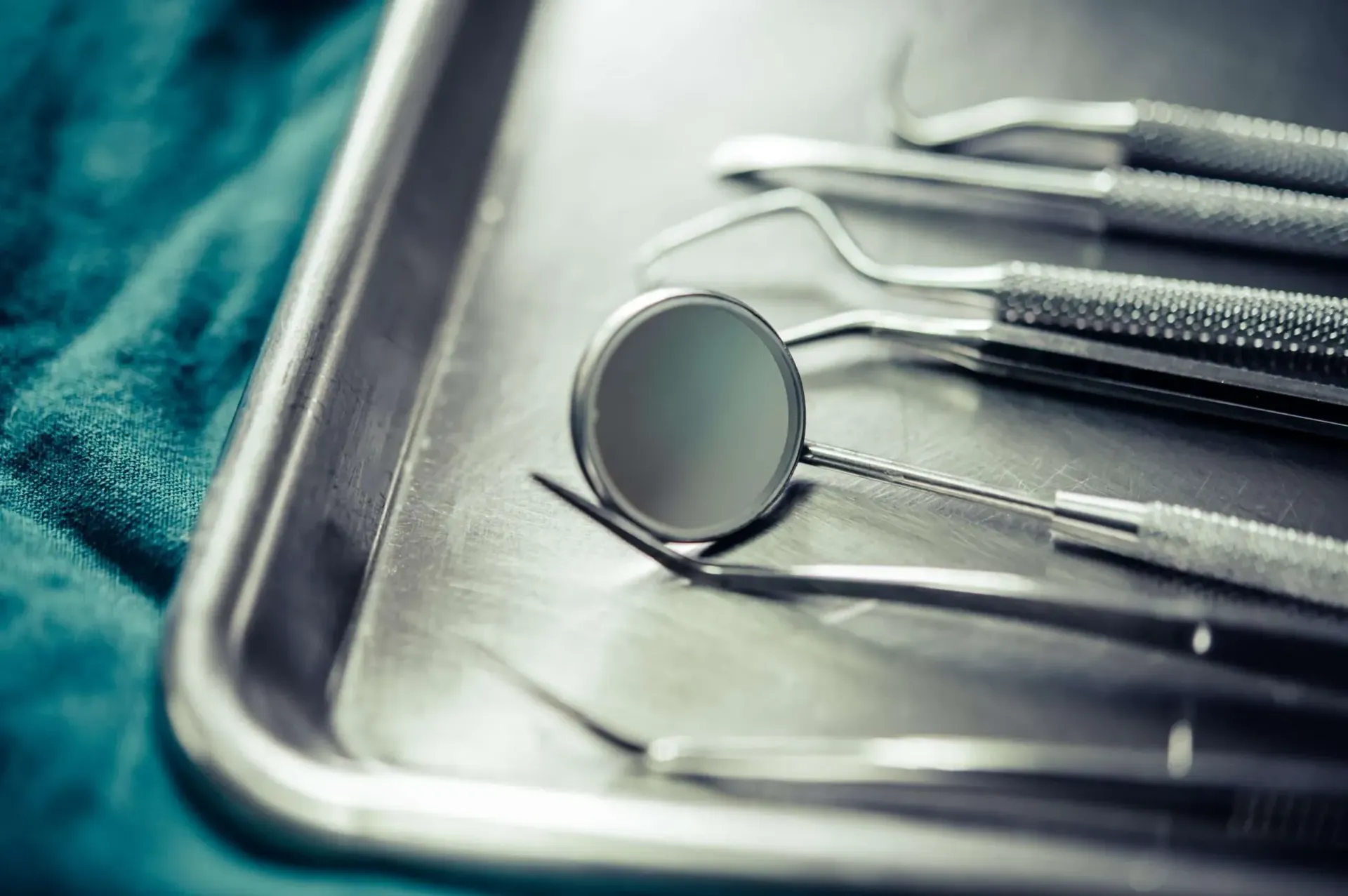 A tray of dental instruments is sitting on a table.
