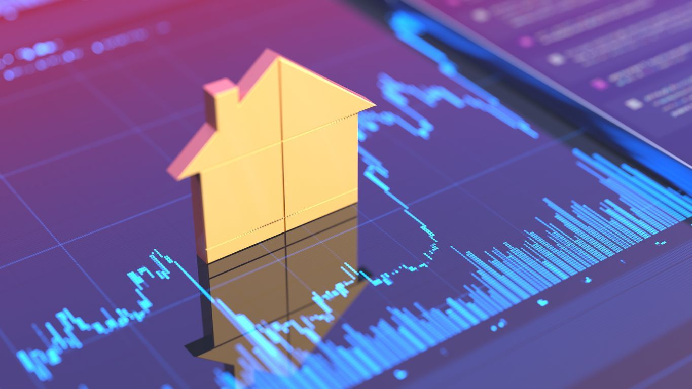 A house is sitting on top of a graph on a computer screen.
