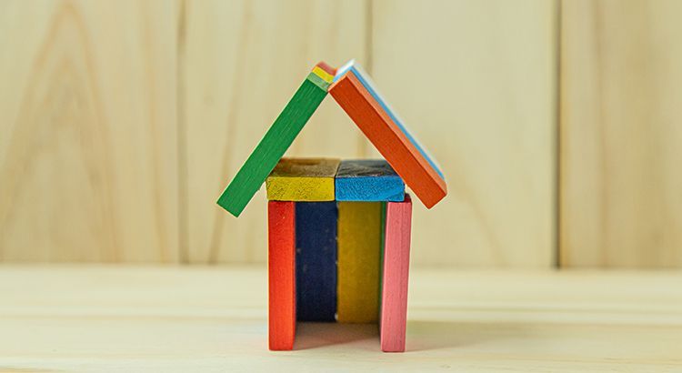 Miniature house made of blocks in various colors