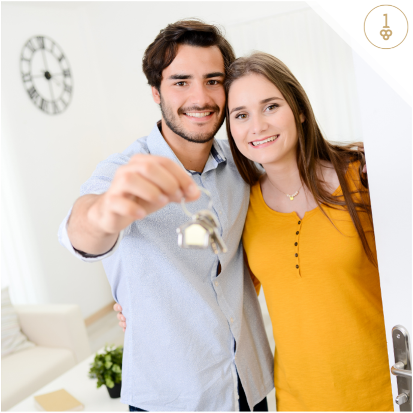 Young couple holding keys