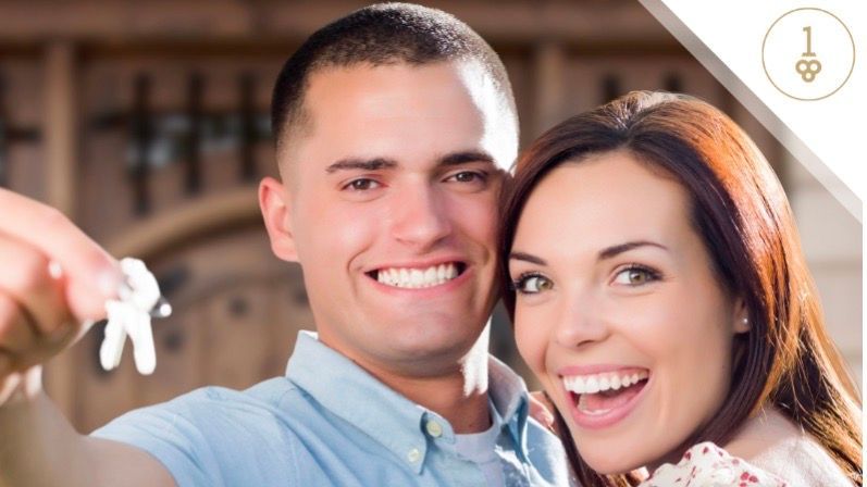 Smiling couple with keys