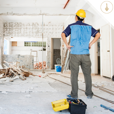 Man standing in middle of room under construction