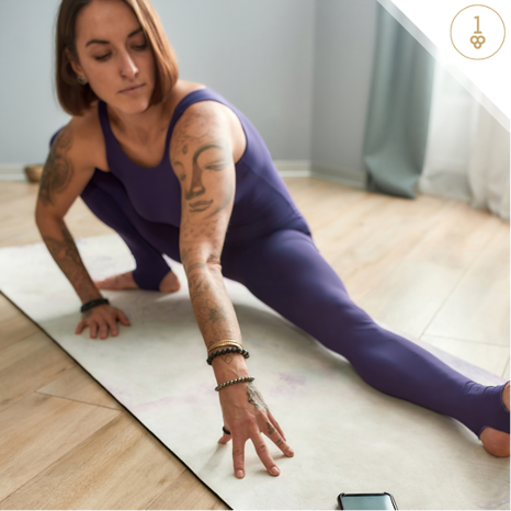 Woman stretching on yoga mat