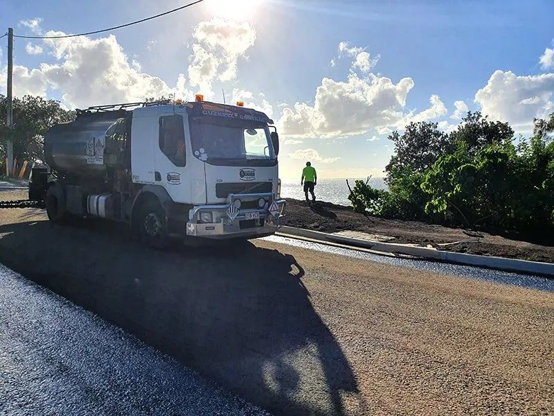A White Truck is Working on the Side of a Road — Cuzkell Pty. Ltd in Dalby, QLD