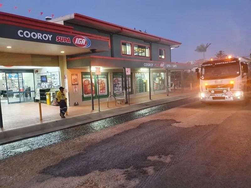 A Truck is Spraying Asphalt in Front of a Store — Cuzkell Pty. Ltd in Cooroy, QLD