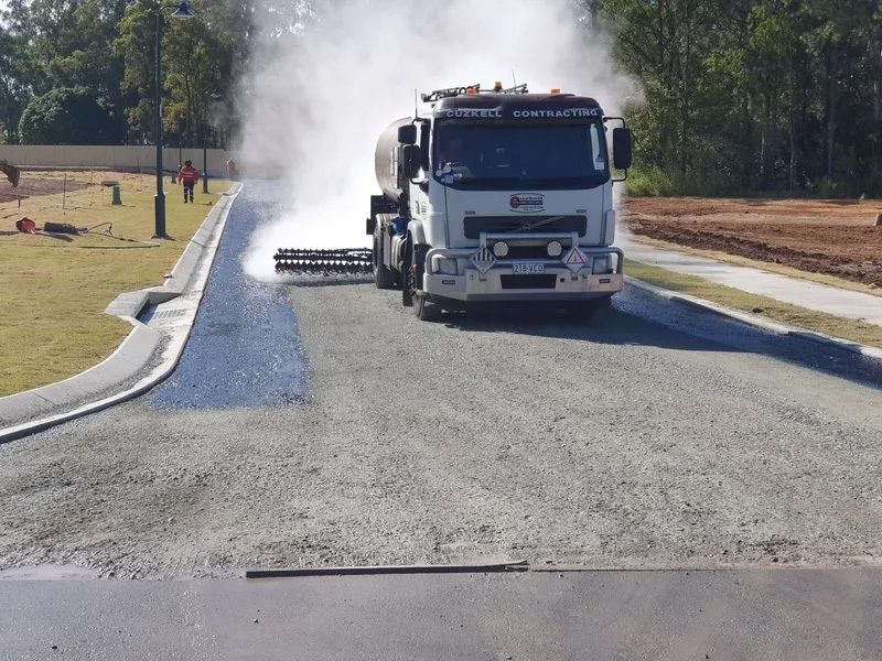 A Truck is Spraying Asphalt on a Street — Cuzkell Pty. Ltd in Cooroy, QLD