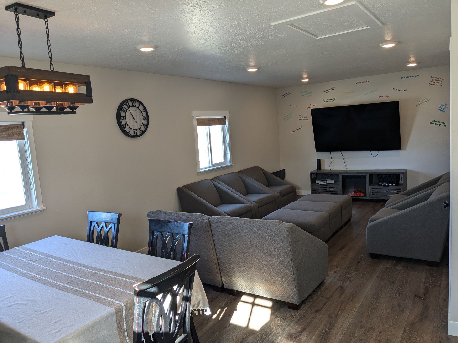 A living room with a flat screen tv and a fireplace