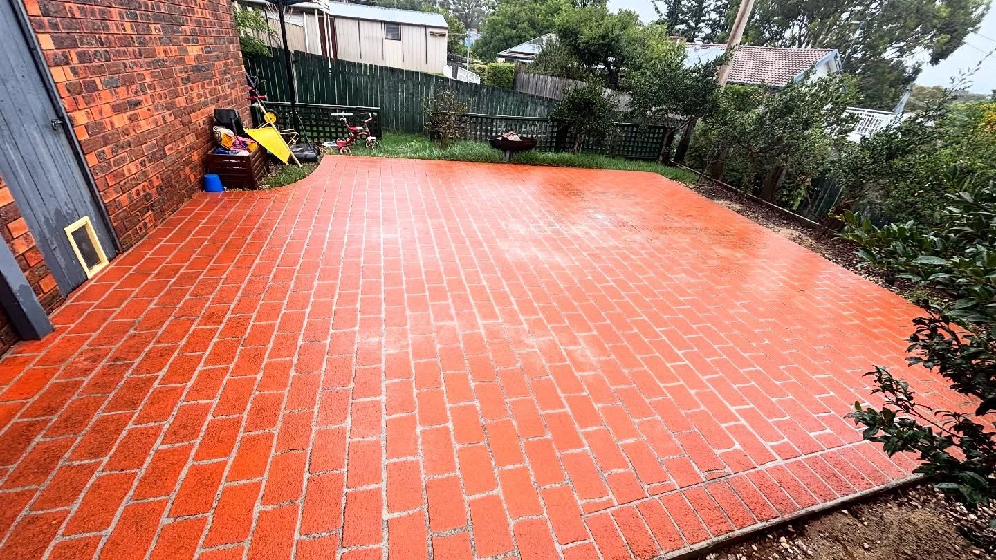 Freshly Painted, Vibrant Orange Brick Patio — Pressure Perfect Cleaning Solutions in Symonston, ACT