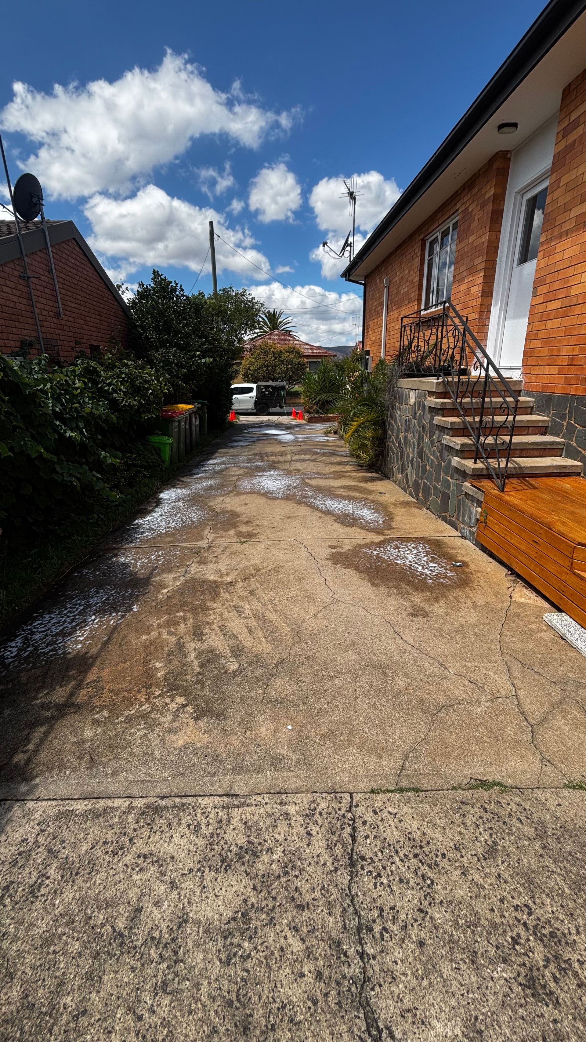 Paved Driveway Leads Toward a Brick House — Pressure Perfect Cleaning Solutions in Symonston, ACT
