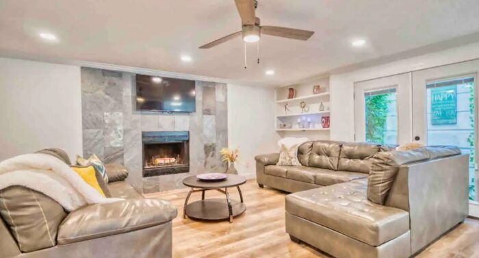 A living room filled with furniture and a fireplace.