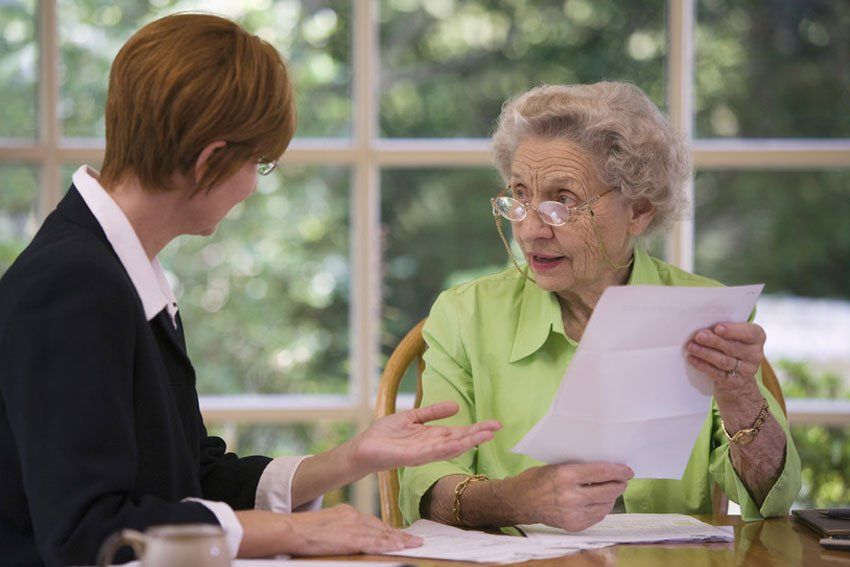 solicitor talking to the elderly lady