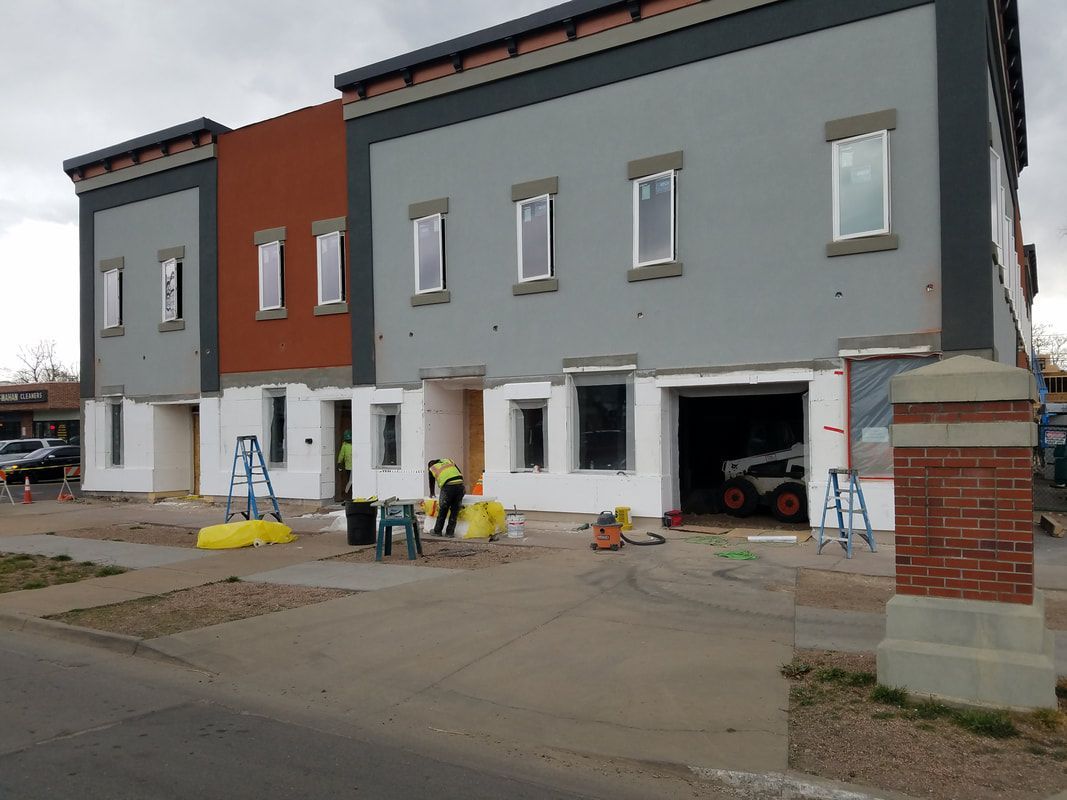 A large building with a lot of windows is being built.