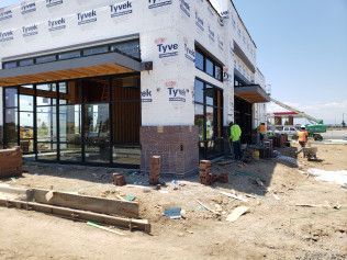 A building is being built with a lot of windows.