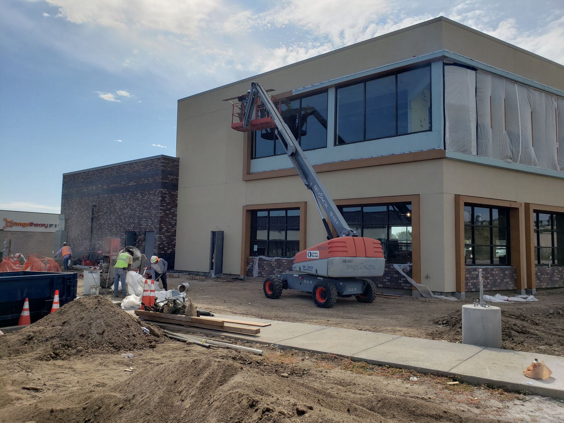 A large building with a lot of windows is being built.