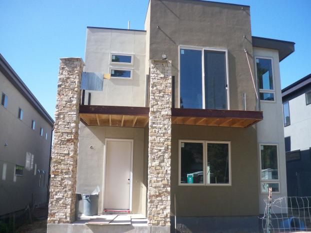 A house with a lot of windows and a balcony