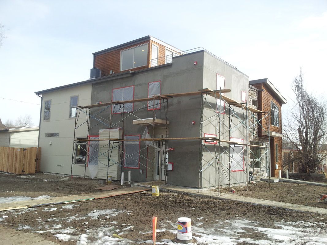 A large building with scaffolding around it is being built.