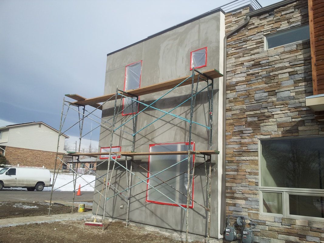 A building under construction with scaffolding on the side of it