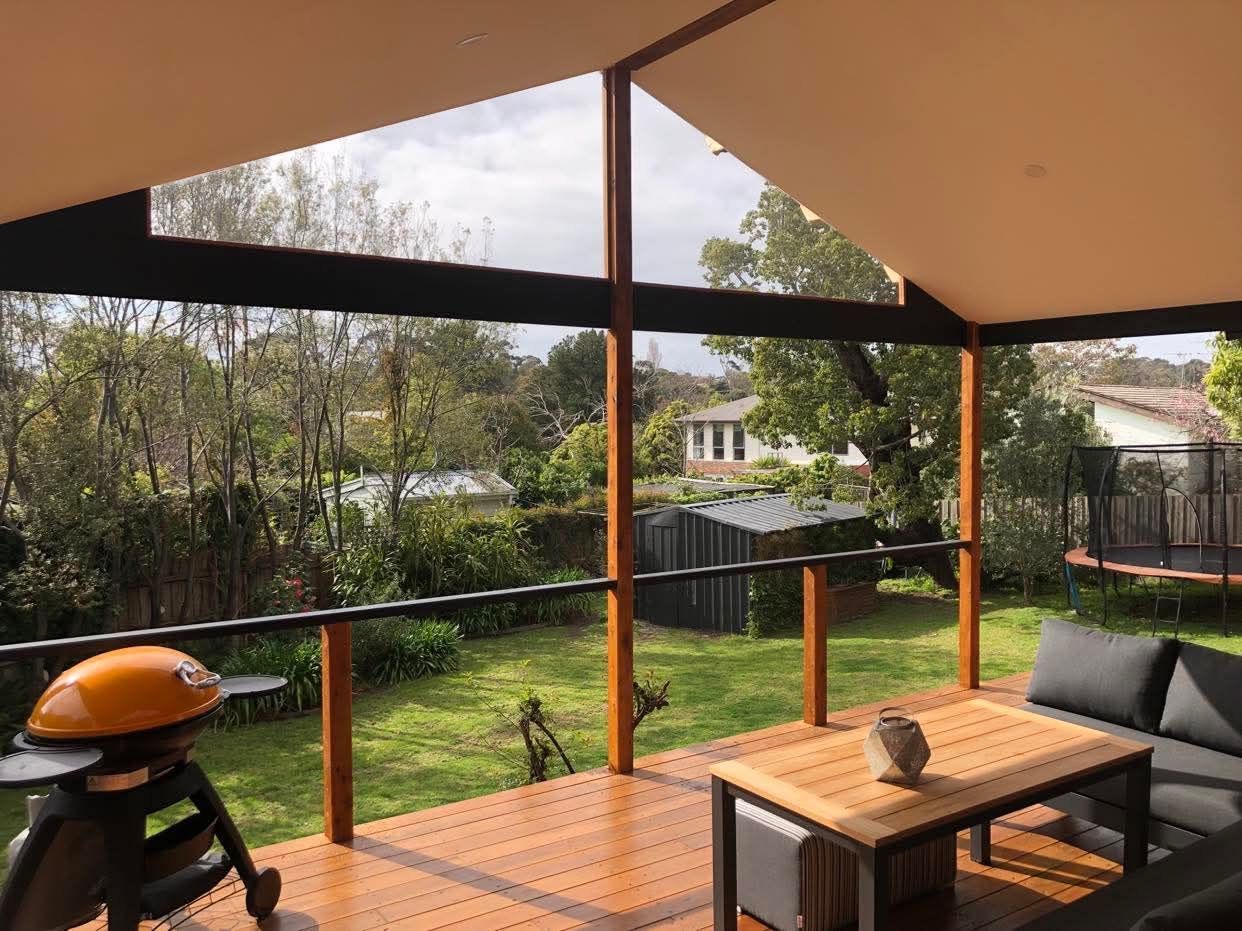 Covered Patio With Wooden Deck with Dining Furniture — RYDALL BUILDING AND DEVELOPMENT in Freshwater, QLD