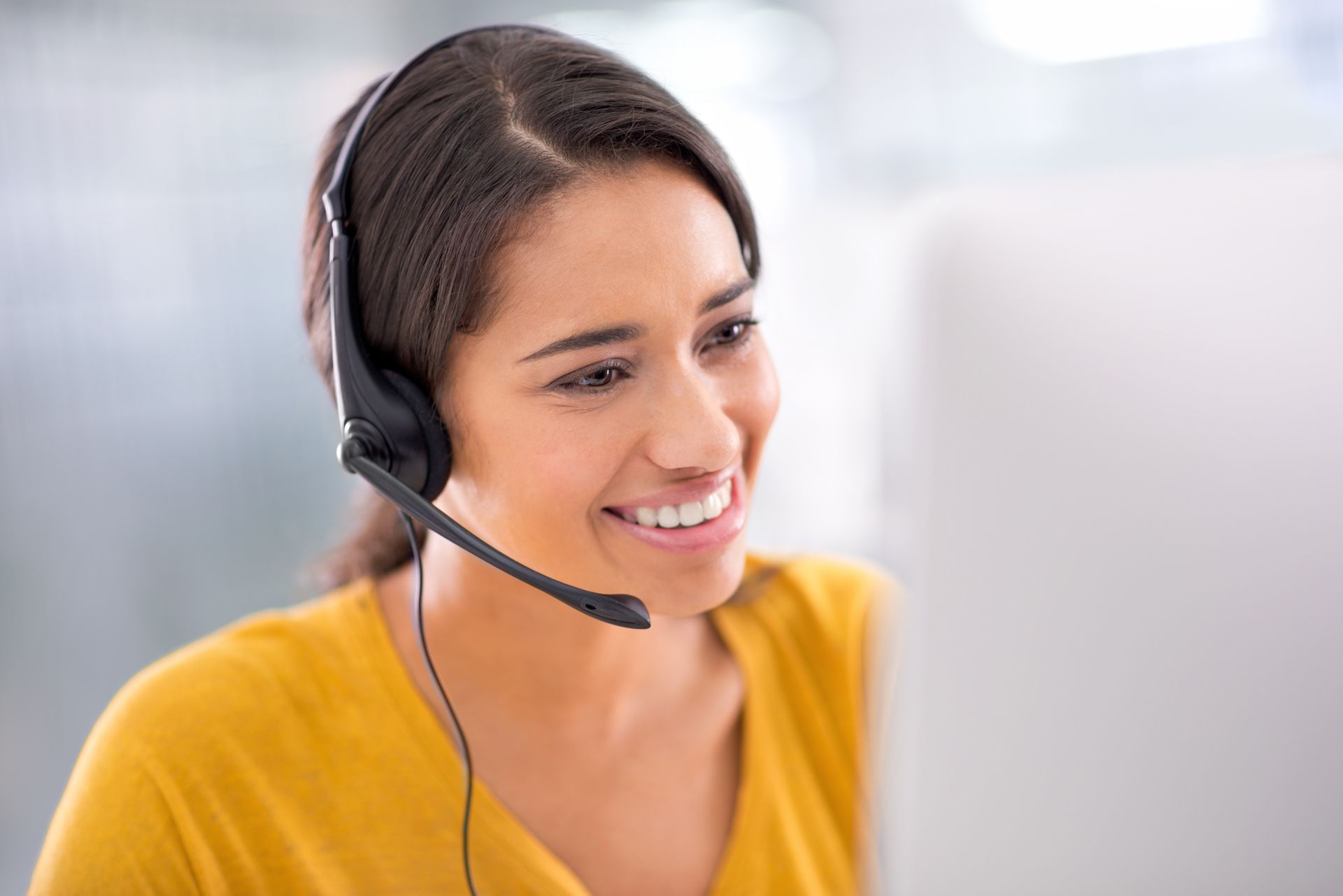 woman with headset and computer